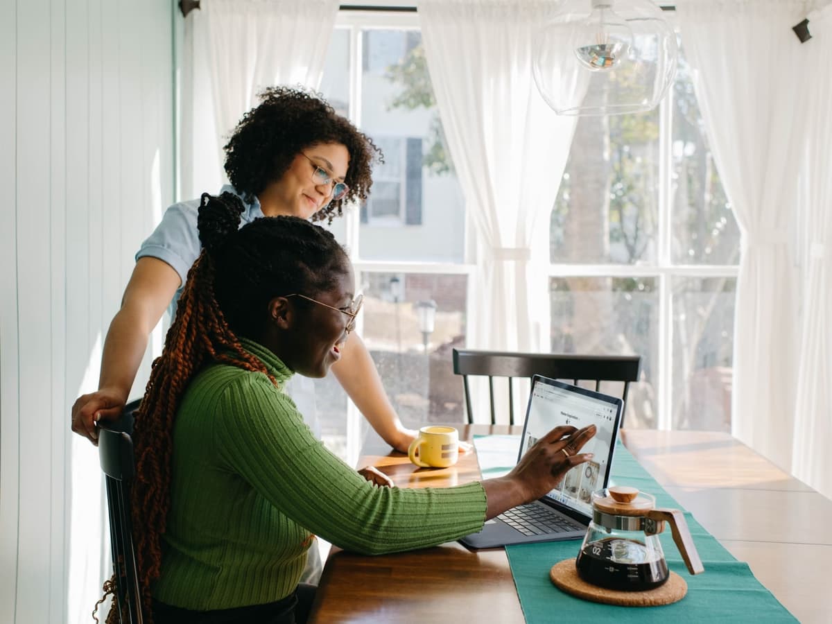 Two women collaborating and working together